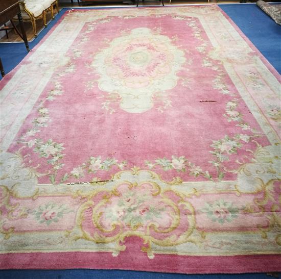 A Donegal Savonnerie pattern pink ground carpet 615 x 345cm